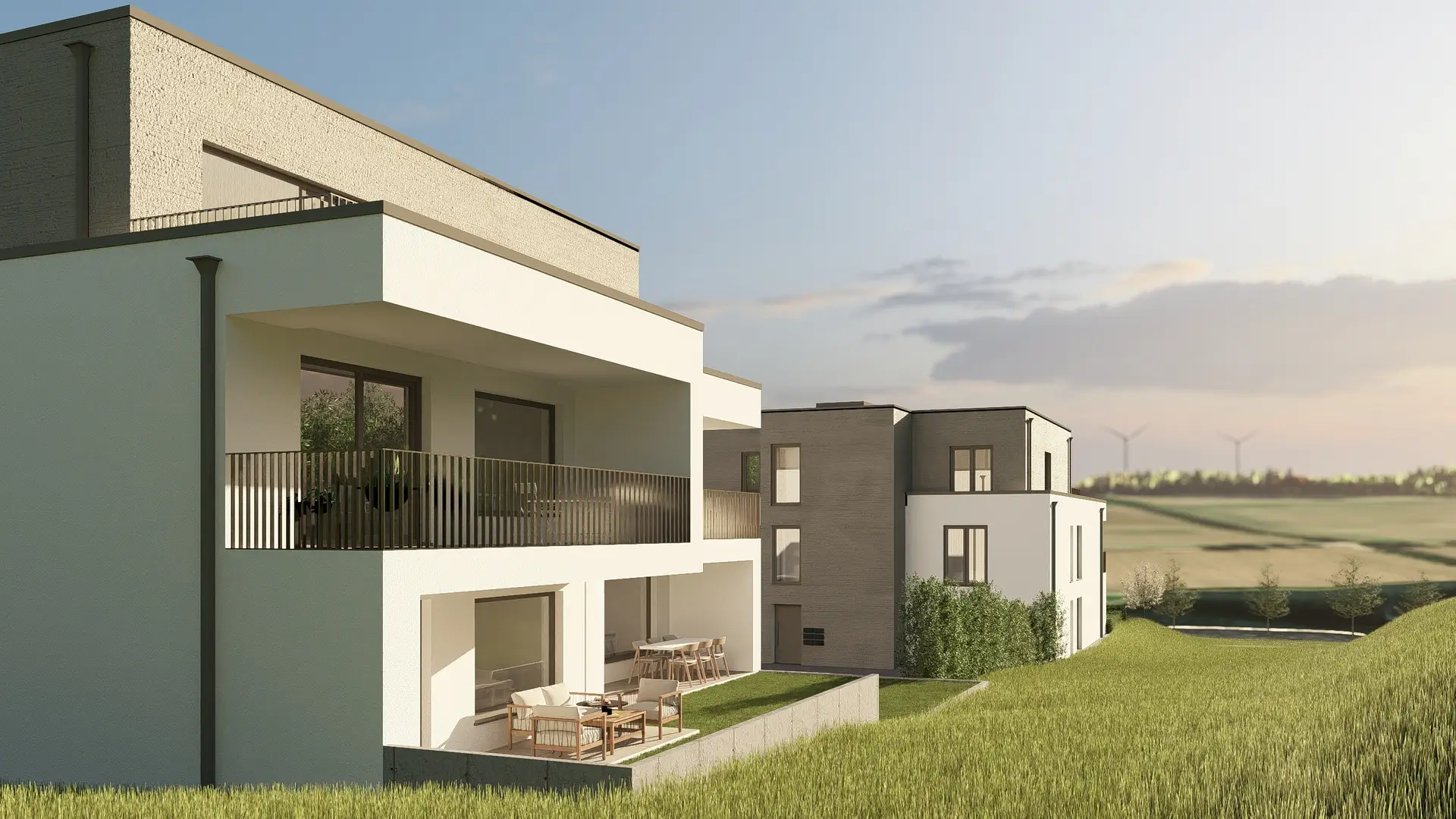 Außenansicht der Mehrfamilienhäuser im Quartier Eicherwald in Erbes-Büdesheim mit Balkonen, Terrassen und Blick ins Grüne