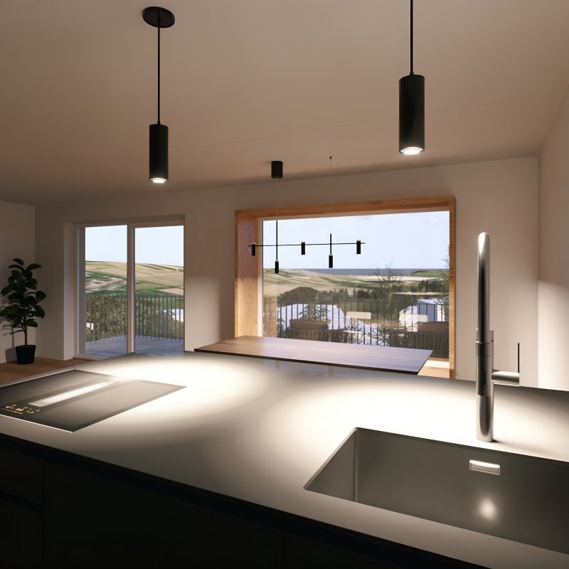 Blick von der Kücheninsel auf Sitzfenster und Landschaftspanorama in einer Wohnung